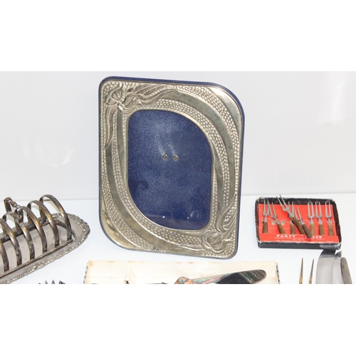 1029 - Qty silver-plated and other metalware items to incl an Art Nouveau style photo frame, flatware, toas... 