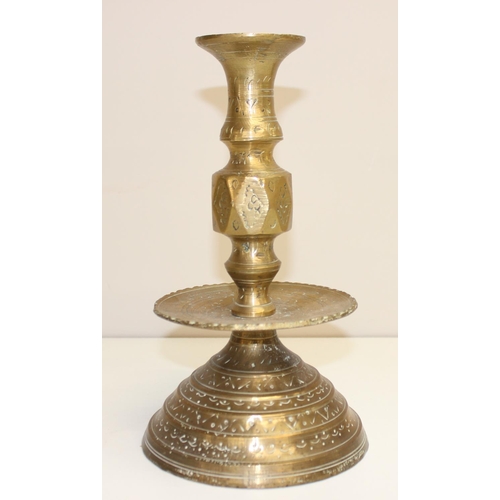 1543 - A pair of 16th century style brass candlesticks of large size with engraved design, approx 27cm tall