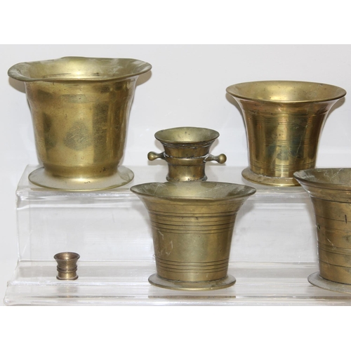 1558 - 8 assorted antique and later brass or bell metal mortars and 4 pestles, the largest approx 11cm tall