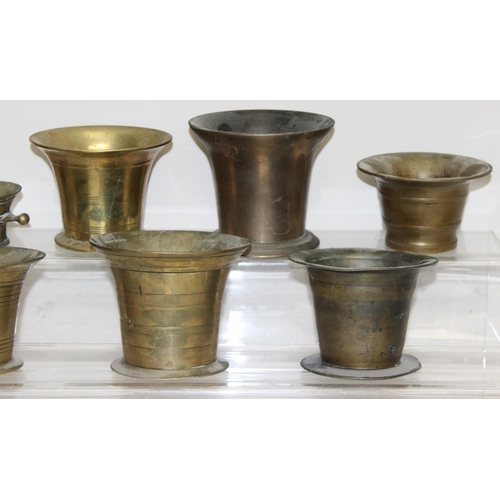 1558 - 8 assorted antique and later brass or bell metal mortars and 4 pestles, the largest approx 11cm tall