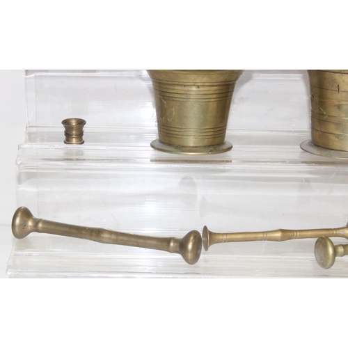 1558 - 8 assorted antique and later brass or bell metal mortars and 4 pestles, the largest approx 11cm tall