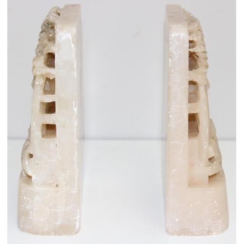 1559 - A pair of Chinese carved soapstone bookends, early 20th century, each approx 18cm tall