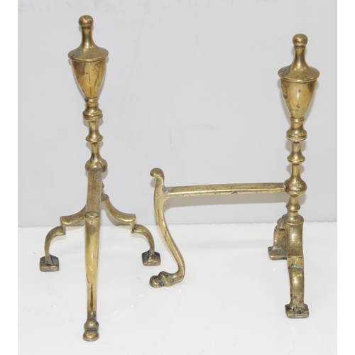 1731 - 2 antique trivets, one brass and the other copper and cast iron, a pair of brass fire dogs (4)