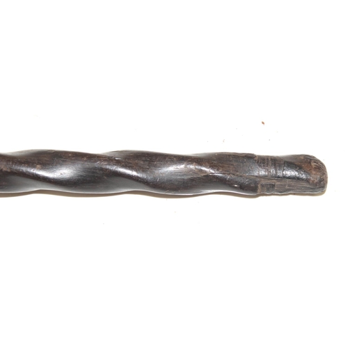 1747 - An antique African carved wooden stick with head pommel and twisted shaft, likely 19th century, appr... 