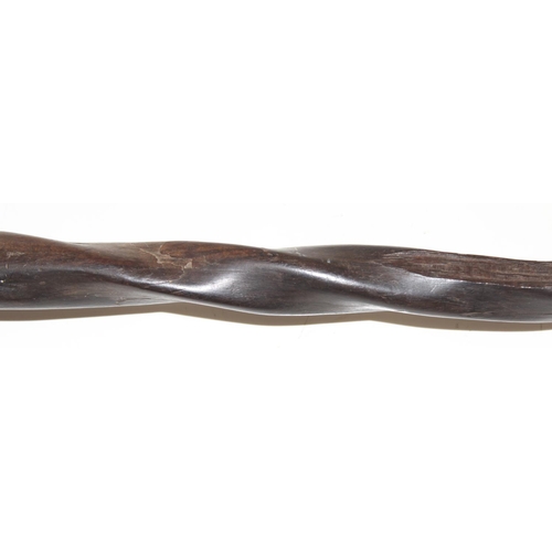 1747 - An antique African carved wooden stick with head pommel and twisted shaft, likely 19th century, appr... 