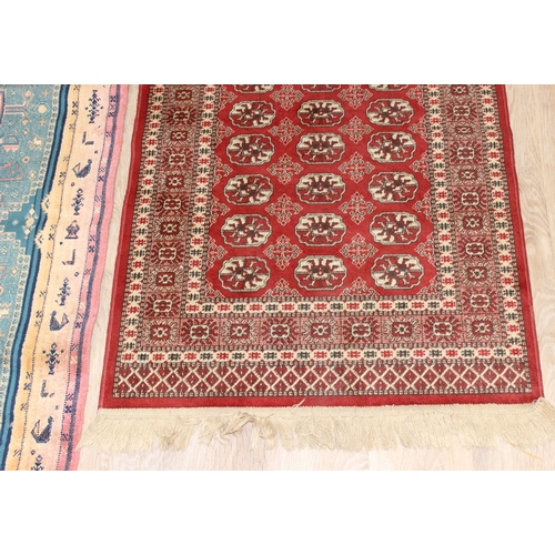 205 - 2 vintage rugs, one colourful geometric style design and a red ground Middle Eastern style rug, larg... 