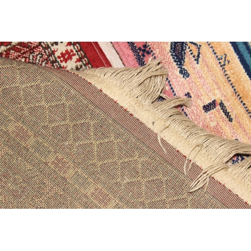 205 - 2 vintage rugs, one colourful geometric style design and a red ground Middle Eastern style rug, larg... 