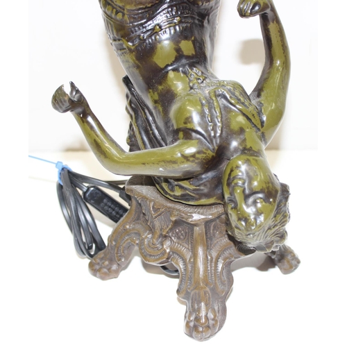 259 - An Art Deco style bronzed metal table lamp formed as a scantily clad female, approx 49cm tall