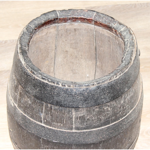 308 - A vintage coopered oak barrel with iron bands, approx 31cm in diameter x 41cm tall