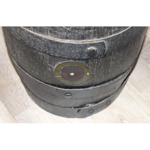 308 - A vintage coopered oak barrel with iron bands, approx 31cm in diameter x 41cm tall