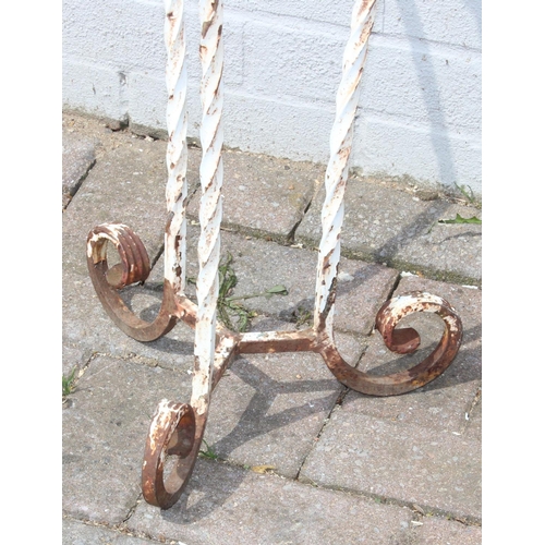 354 - A vintage twisted wrought iron garden pot stand with terracotta pot, approx 100cm tall