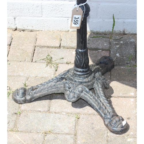 359 - Circular marble topped table with black painted cast iron tripod base, approx 72cm H x 56cm W