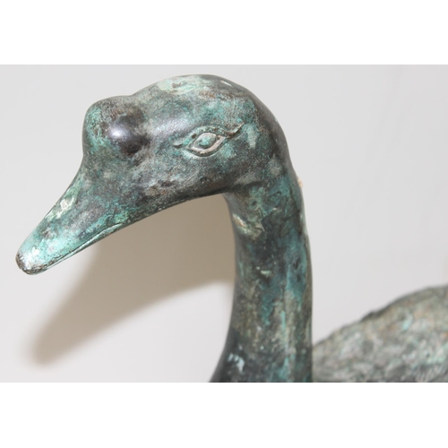 373 - An unusual vintage metal swan garden ornament with Verdigris finish, approx 31cm tall