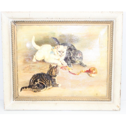 469 - A vintage oil on canvas of cats playing with an apple, unsigned but various annotations verso, appro... 