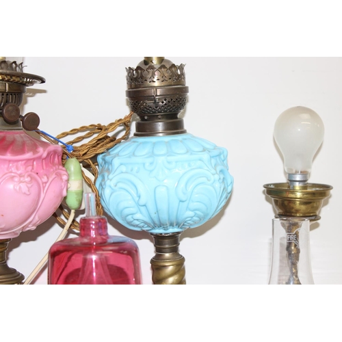 261 - Qty of antique and later oil lamps and parts to incl an etched glass shade etc