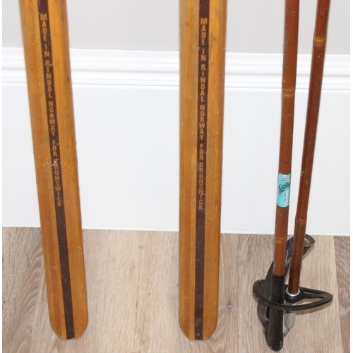 721 - Pair of vintage Norwegian wooden cross country skis with Rottefella bindings, and a pair of wooden s... 