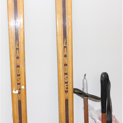 721 - Pair of vintage Norwegian wooden cross country skis with Rottefella bindings, and a pair of wooden s... 