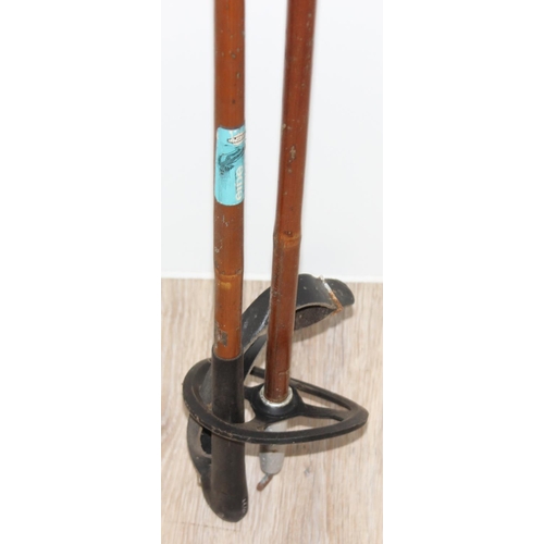 721 - Pair of vintage Norwegian wooden cross country skis with Rottefella bindings, and a pair of wooden s... 