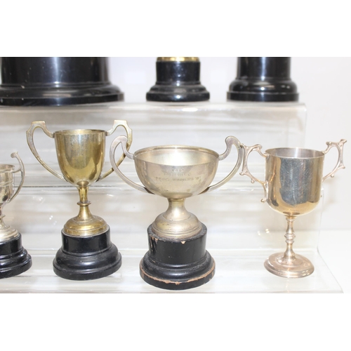 1053 - Qty of vintage silver-plated trophies on stands, approx 5.4kg gross