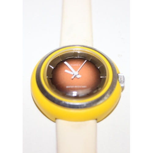 1311 - 2 watches to incl a retro Timex wrist watch with yellow plastic and stainless steel case and cream v... 