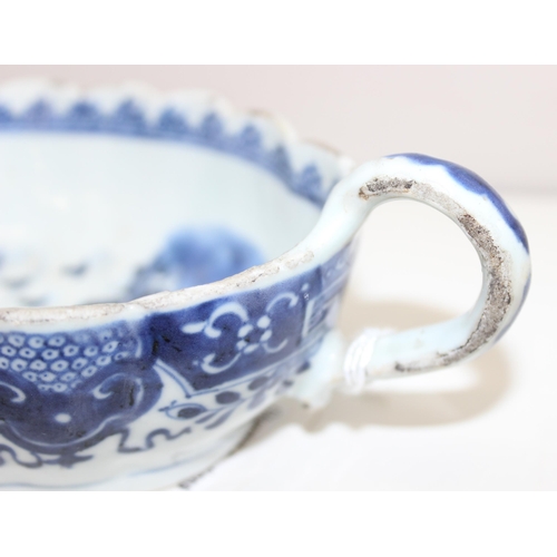 1765 - An antique Chinese blue and white gravy boat of ribbed form, likely 19th century, approx 20cm long