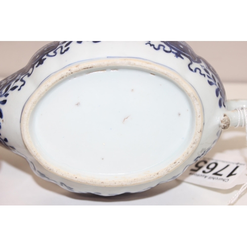 1765 - An antique Chinese blue and white gravy boat of ribbed form, likely 19th century, approx 20cm long