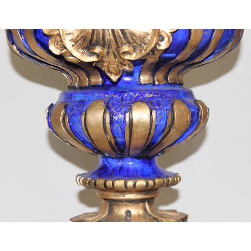 1784 - A pair of gold and blue relief decorated Regency style urn displays, each approx 70cm tall