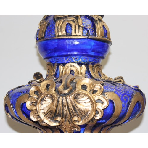 1784 - A pair of gold and blue relief decorated Regency style urn displays, each approx 70cm tall