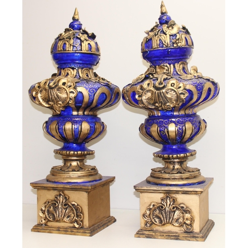 1784 - A pair of gold and blue relief decorated Regency style urn displays, each approx 70cm tall