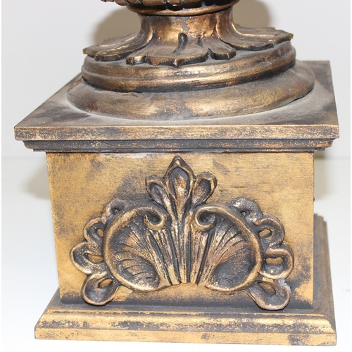 1785 - A pair of gold relief decorated Regency style urn displays, each approx 70cm tall