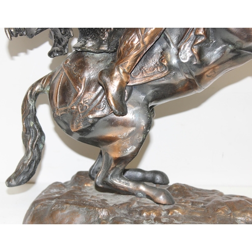 1788 - A large bronzed metal figure of a horse and warrior, approx 45cm tall