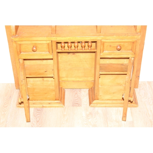 113 - Wall mountable pine kitchen unit of small proportions with glazed cupboards, approx 82 x 19 x 73cm