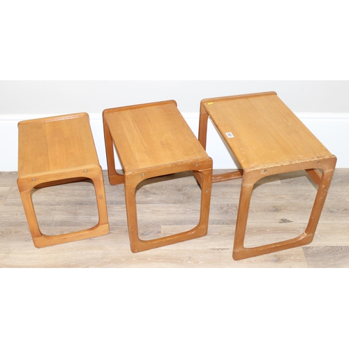 115 - A nest of G-Plan style tables, seemingly unmarked, the largest table approx 57cm x 40cm x 51cm tall