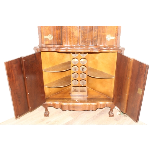 125 - An unusual retro scalloped corner drink or cocktail cabinet with brass strap hinges and mounts and c... 