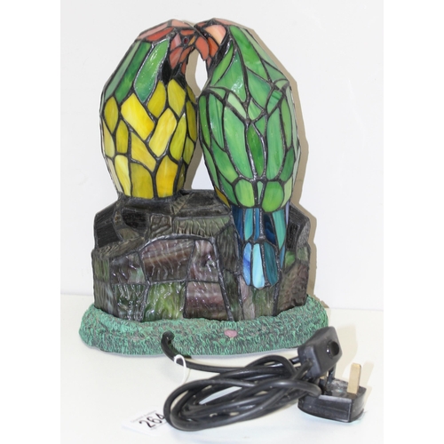 264 - A vintage Tiffany style leaded glass lamp formed as 2 parrots or love birds, approx 31cm tall