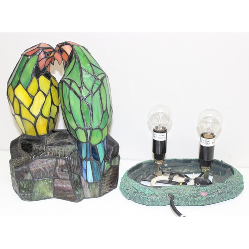 264 - A vintage Tiffany style leaded glass lamp formed as 2 parrots or love birds, approx 31cm tall