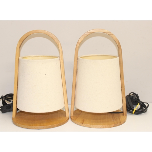 276 - A pair of Scandinavian style bentwood table lamps with shades and an unusual wooden table lamp of bu... 