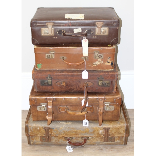 323 - 5 assorted vintage suitcases, 2 good quality leather examples and some with labels, the largest appr... 