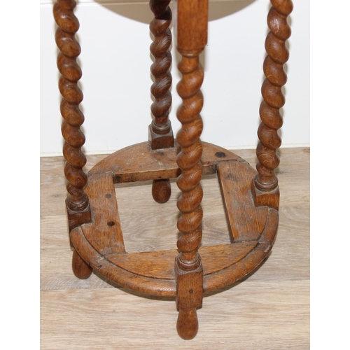 324 - A vintage oak stick stand with barley-twist supports and a small Liberty style Moorish side table or... 