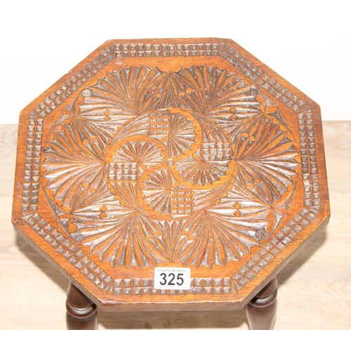 325 - An Arts & Crafts period octagonal topped side table with chip carved details, approx 35cm wide x 38c... 