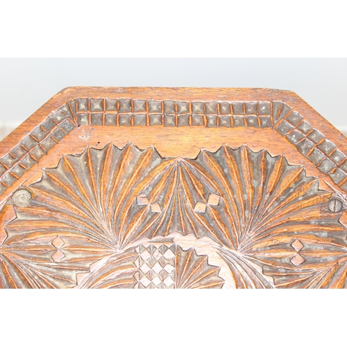 325 - An Arts & Crafts period octagonal topped side table with chip carved details, approx 35cm wide x 38c... 