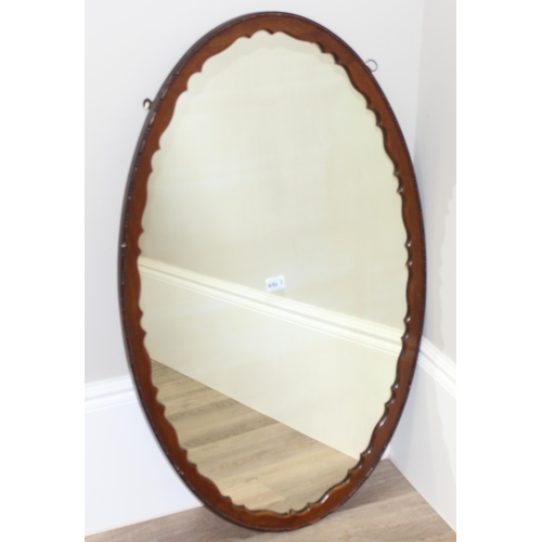 450S - Large oak framed oval mirror with decorative wooden edge, approx 107cm x 65cm