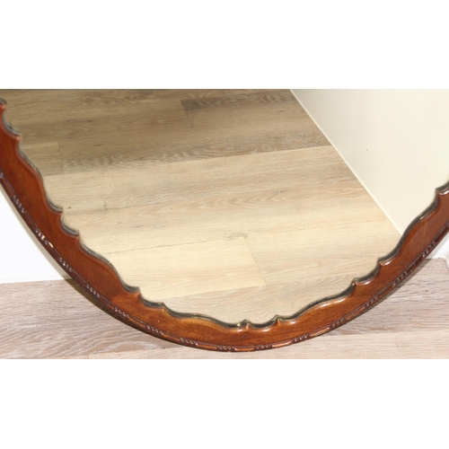 450S - Large oak framed oval mirror with decorative wooden edge, approx 107cm x 65cm