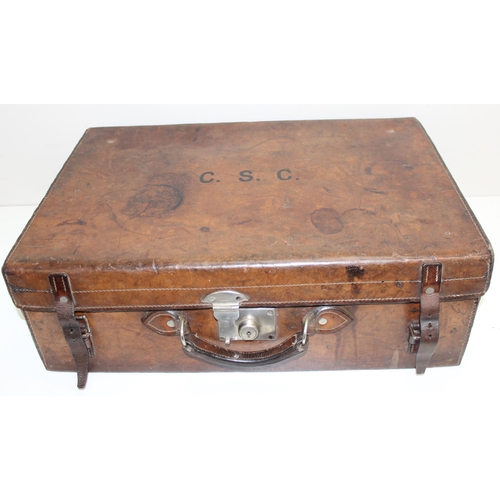 1085 - A Victorian Gentleman's leather suitcase with silver-topped vanity bottles, the case made by S. Fish... 