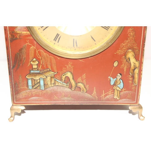 1316 - An early 20th century red lacquer cased Mappin & Webb Chinoiserie mechanical mantel clock with brass... 