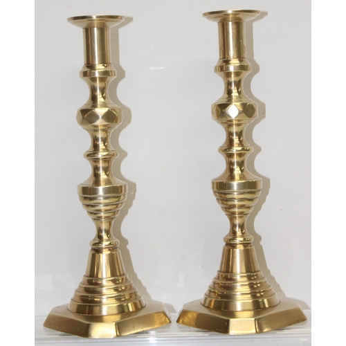 1799 - Pair of antique diamond shaped brass candlesticks with ejectors, approx 28cm