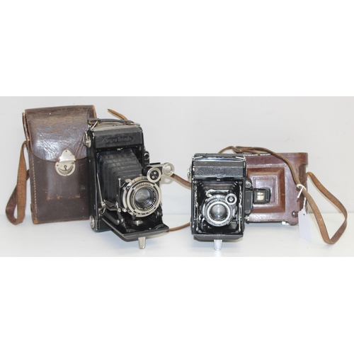 735 - 2 vintage Zeiss Super Ikonta cameras, models 530 & 530/2, both with Tessar lenses and leather cases