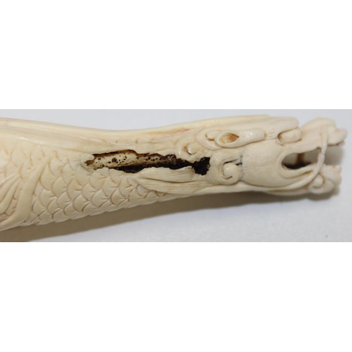 1686 - 3 vintage carved smoking pipes, one in case and a piece of carved bone in the form of a dragon (4)