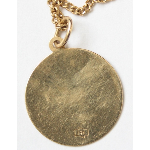 1101 - An American 14ct gold necklace with 14ct gold pendant depicting Water Tower Place Chicago, marked an... 