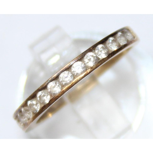 1108 - A 9ct gold and white stone half eternity ring, marked and XRF confirmed, approx size J, approx 1.38g... 